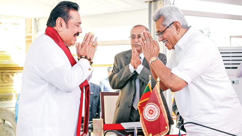 Mahinda Rajapaksa being sworn in as Prime Minister before President Gotabaya Rajapaksa at the Kelani Raja Maha Vihara a year ago