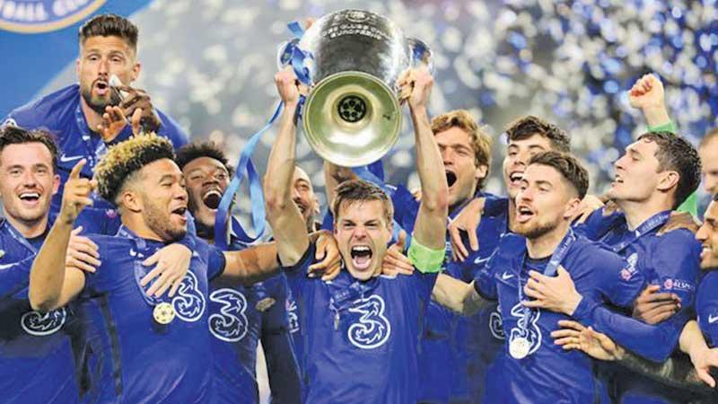 The Chelsea team celebrate with the trophy