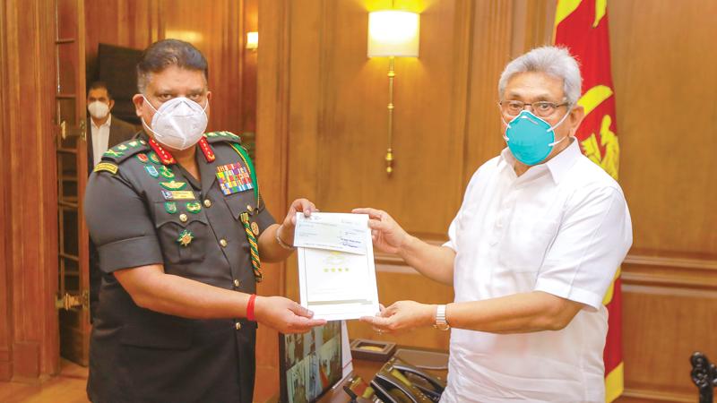 Gen. Shavendra Silva presents the cheque to President Gotabaya Rajapaksa