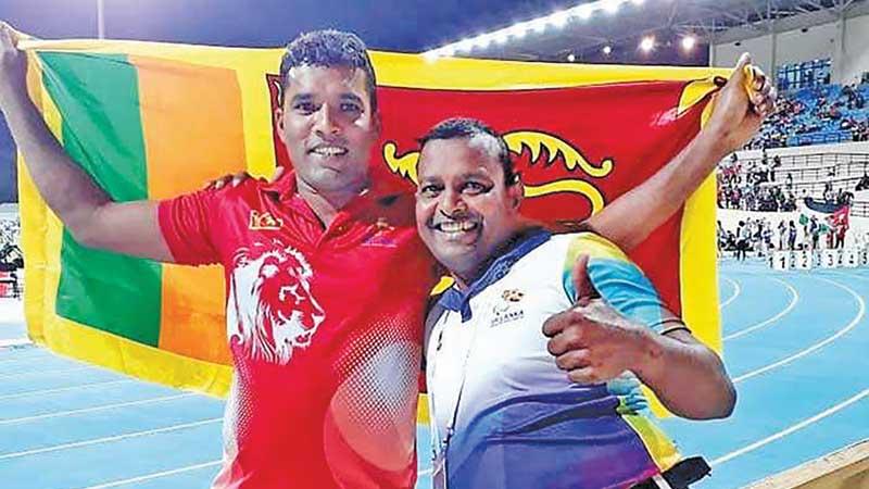 Dinesh Priyantha Herath with his coach Pradeep Nishantha