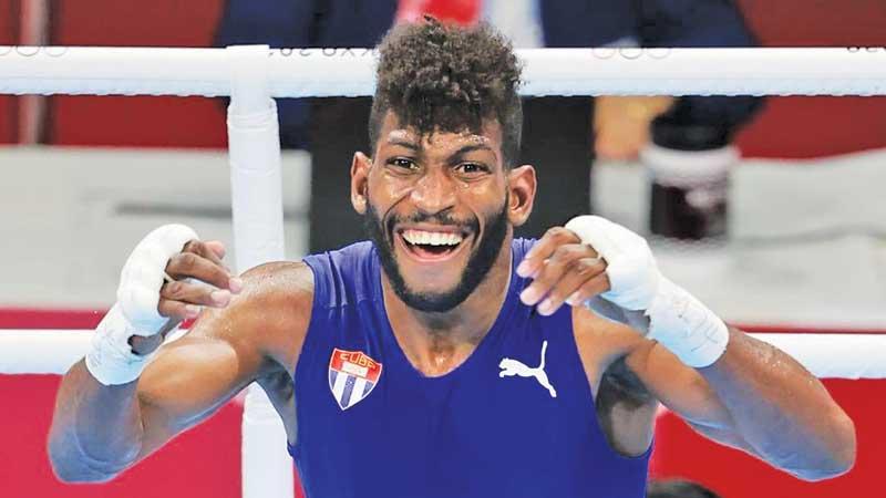 Andy Cruz of Cuba celebrates victory in Men’s Lightweight (57-63kg)