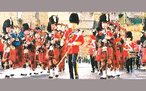 Bagpipers of the British Army playing at a military parade
