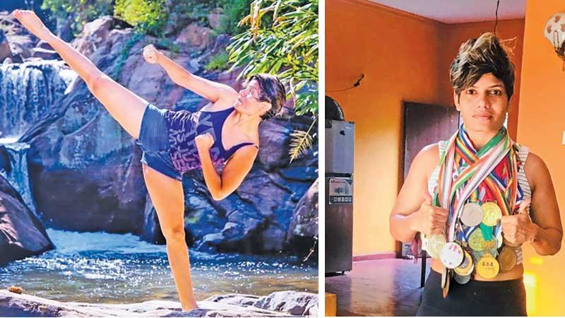 Dinusha gets a kick out of karate-Dinusha with her many medals