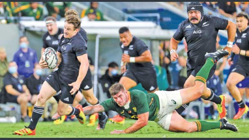A South African player goes down missing his tackle