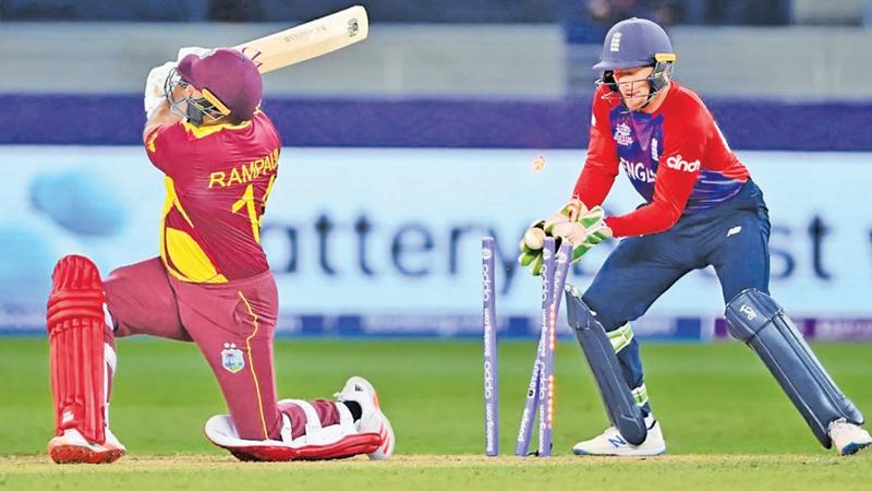 The last West Indies batter Ravi Rampaul is bowled by Adhil Rashid (not in picture) as wicket keeper Jos Buttler looks on