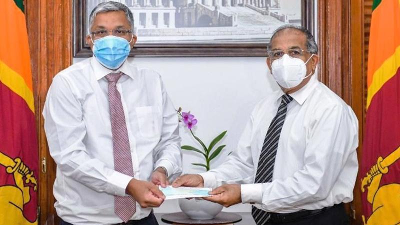 Lanka Hospitals Corporation PLC - Group Chief Executive Officer, Deepthi Lokuarachchi (on left) presents the cheque to Additional Secretary to the President and Chief of Staff Major General (Retd) K.B. Egodawele