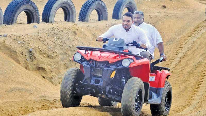 Sports Minister Namal Rajapaksa and Tourism Minister Prasanna Ranatunga take a ride at the inauguration of Colombo Dunes in the Port City (Pic by Sudath Malaweera)