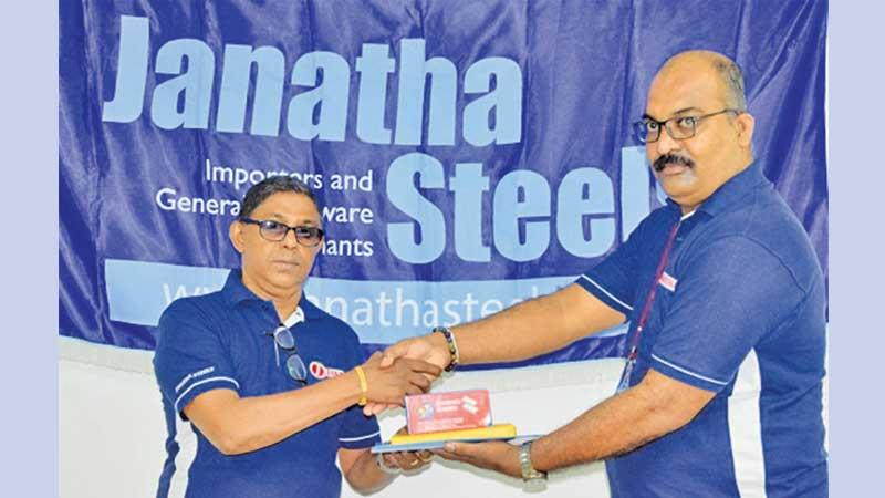Lalith Priyantha former table tennis champ receives a sponsorship from GAP Roshan, General Manager of Janatha Steels
