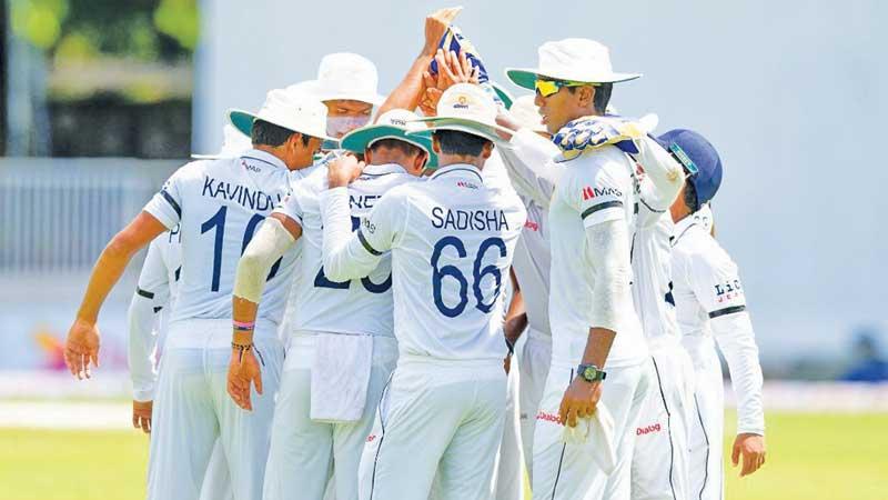 Royal College players observe a moment during the 142nd Battle of the Blues against S. Thomas’