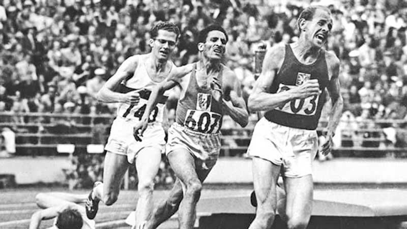 Emil winning three Gold medals in 5000m, 10,000m and marathon