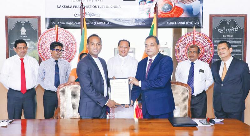 After signing the agreement. Chairman, Sala Group, Chinthaka Wijewickrama with Chairman, Laksala, Lakmal Wickramaarachchi.