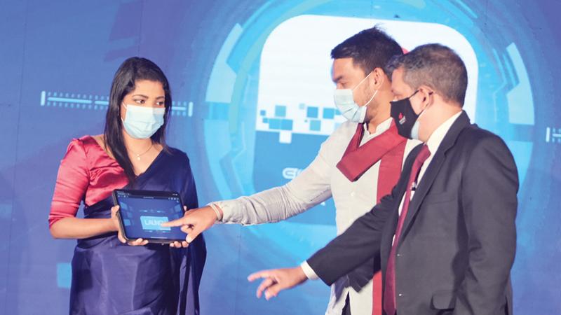 Minister of Youth and Sports, and Minister of Development Co-ordination andMonitoring and State Minister of Digital Technology and Enterprise Development Namal Rajapaksa and Chief Executive Officer/ General Manager of People’s Leasing & Finance PLC ShamindraMarcelline, launches the new PLC Touch app.