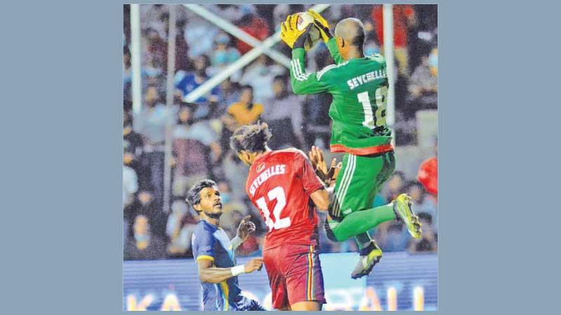The Seychelles goal keeper collects the ball in the air to stave off an attack by Sri Lanka (Pic by Sulochana Gamage)