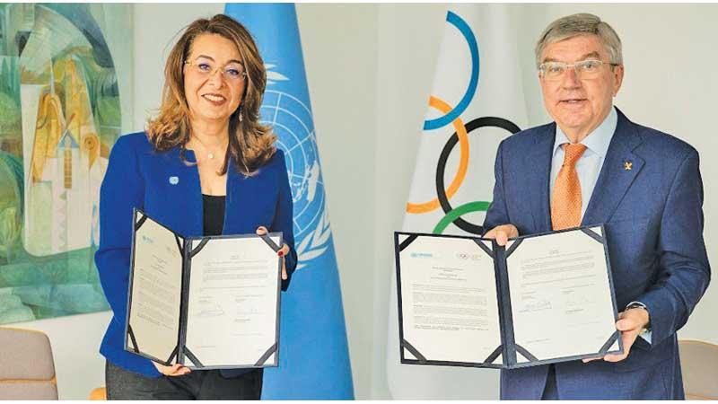 IOC president Thomas Bach (right) and UNODC Executive Director Ghada Waly