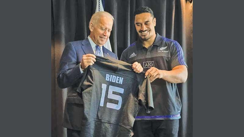 File photo: Joe Biden receives a personalised All Blacks rugby jersey from Jerome Kaino (right) during his visit to Auckland in 2016