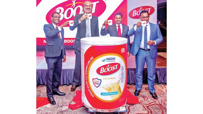 Nestle and A. Baur & Co officials launch the nutritional food drink.