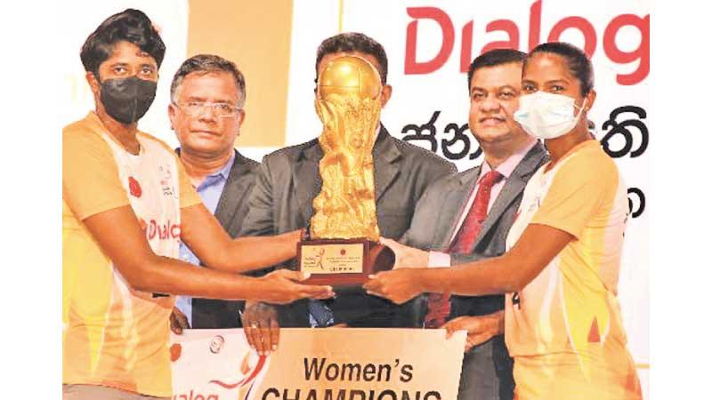 Chathurika Ranasinghe the skipper of Vijaya SC, winners of the women’s segment in the Dialog President’s Cup Volleyball Championship, receiving the Cup from Group Chief (Technology) Dialog Axiata, Pradeep de Almeida and President SLVF Kanachana Jayaratna. Also in the picture is the Director General of Sports, (Sports Ministry) Amal Edirisooriya