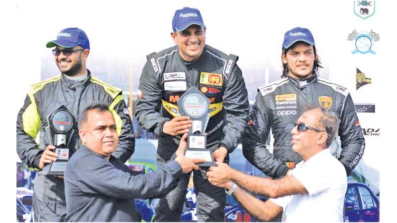 Ashan Silva who won a double in the SL-GT 3,500cc, category on the podium with runners-up Kaushalya Samarasinghe (left) and second runner up Rohitha Rajapaksa (right) receiving their Awards from Deputy Marketing Officer SLT-Mobitel Rohana Ellawala