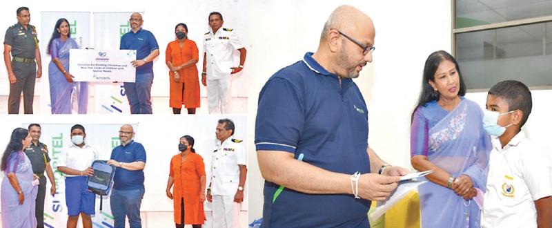 Chief Marketing Officer of Mobitel, Shashika Senarath makes the donation. Chairperson, SERRIC, Sonia Kottegoda and SERRIC officials look on.