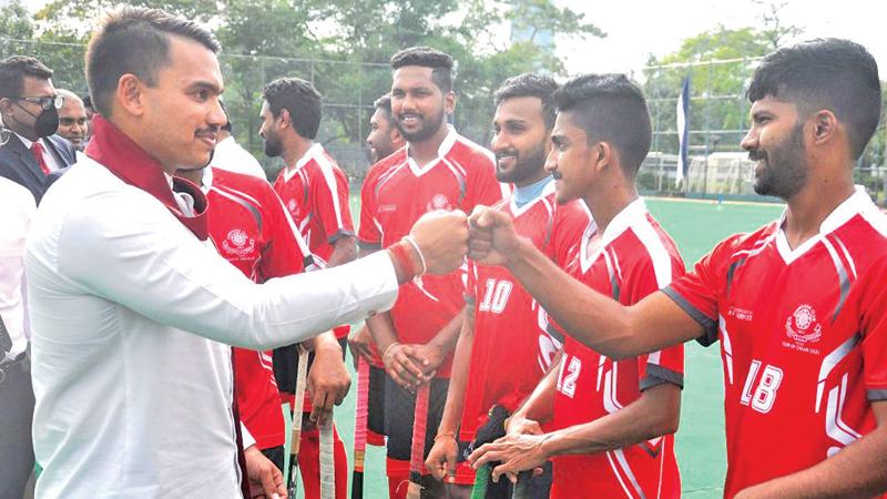 CH and FC sticker Gimhara does a fist bump with Sports Minister Namal Rajapaksa before the start of the exhibition match Pictures by Sudath Malaweera