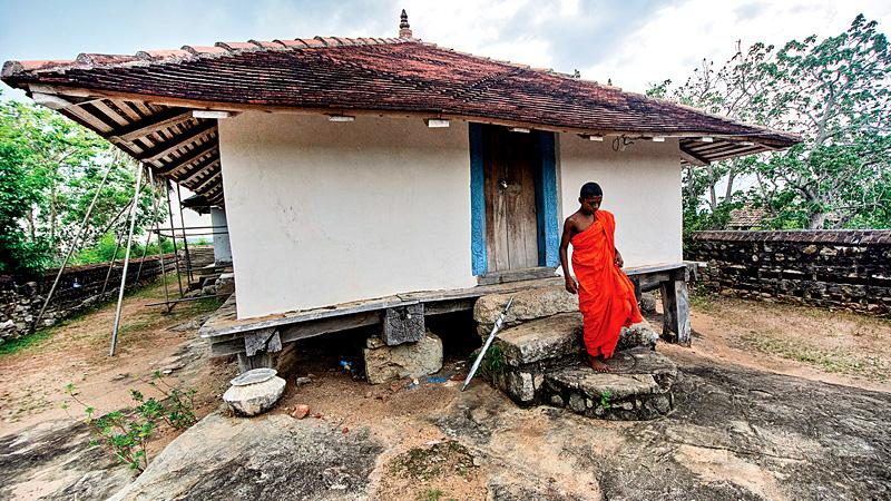 The Bihalpola Tampita Vihara built on wooden beams on a rock boulder