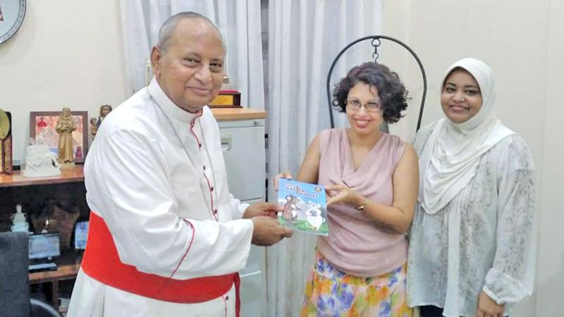 Nadishka Aloysius presenting her book  'That Easter Sunday' to Archbishop Malcolm Cardinal Ranjith 