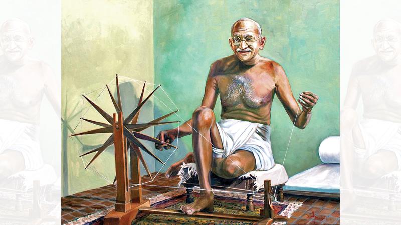 Mahatma Gandhi with the spinning wheel 