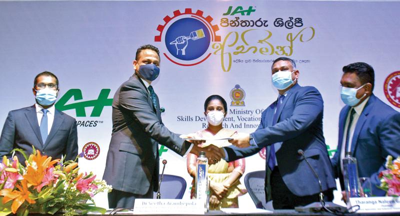 The exchange of the MoU. State Minister Dr. Sita Arambepola and officials looks on. Pic: Sudath Nishantha