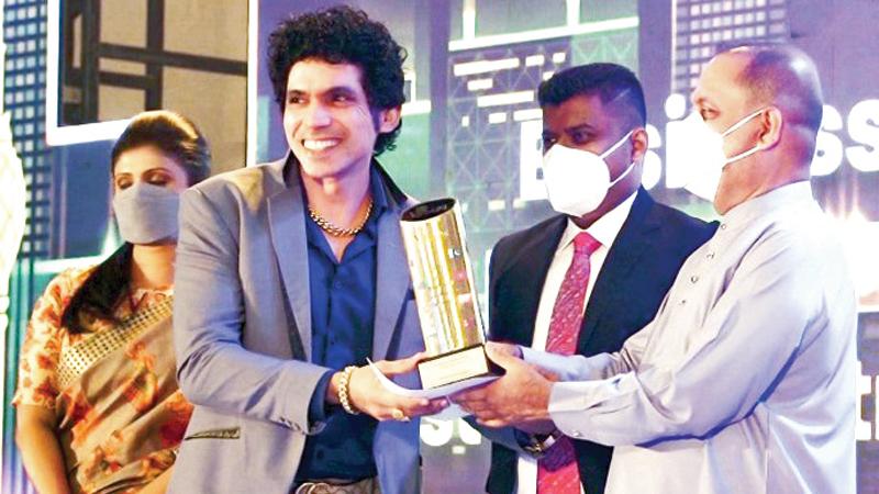 Chairman and MD of HTS Holdings, Rathnasiri Priyantha receives one of the awards.