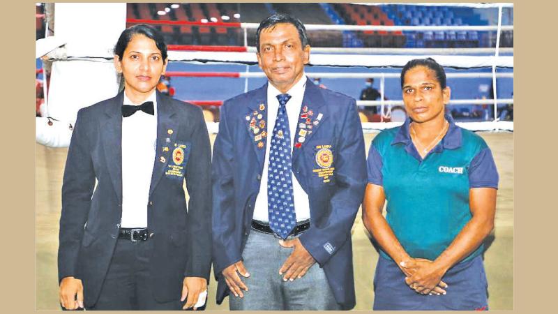 Reunion of the pioneers: Niroshini Bodhipaksha (left) with her coach Capt. RK Indrasena (Rtd) and Army team mate Chandrika Guruge