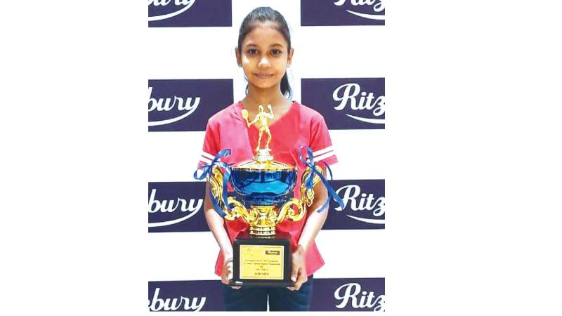 Ifra Shasmin Booso with her trophy at the 32nd Junior National Squash Championship