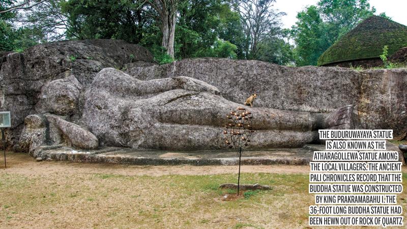 The 36-ft long rock hewn reclining Buddha statue of Buduruwayaya