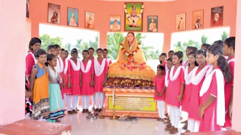 Students of the Sri Sarathadevi Girls Home posing after signings Bhajan, Homam and Pooja. Pic: Sivam Packiyanathan, Batticaloa Spl. Cor.