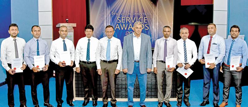 Those who contributed over 10 years of service to SLT VisionCom. From left:  Eranda Gunawardena, Baratha Karunarathne, Ruchira Weerakoon,  CEO SLT VisionCom, Ajantha Seneviratne,  Group CEO, SLT-Mobitel, Lalith Seneviratne,  Group Chairman SLT-Mobitel, Rohan Fernando, Mevan Attanayake, Gayan Madhuranga, Sripali Bandara and Rukshan Jayawardene.