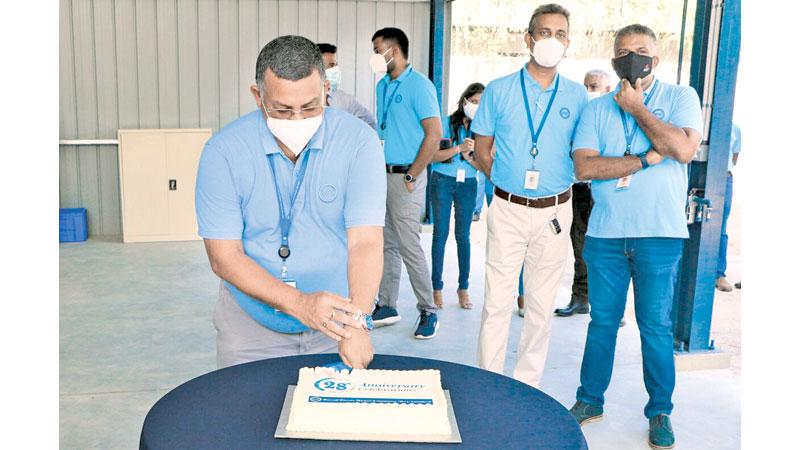 DPMC Director, Parts and Accessories, Jayantha Ratnayake cuts the anniversary cake