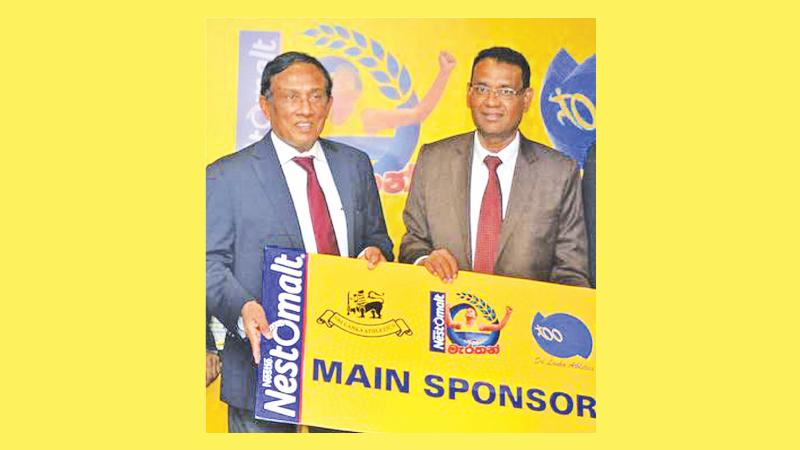 Athletics chief Maj. Gen. Palitha Fernando (left) receiving the sponsorship from Bandula Egodage the Vice President of Corporate and Regulatory Affairs of Nestle (Pic by Ranjith Asanka)