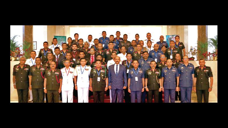 A grouping of middle-grade military officers with Defence Secretary Gen. Kamal Gunaratne and other senior military officers