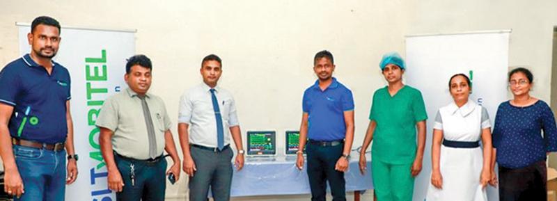 SLT-Mobitel officials present the MultiPara Monitors to Hospital Director, Balapitiya Base Hospital, Dr. K. Samarathna.