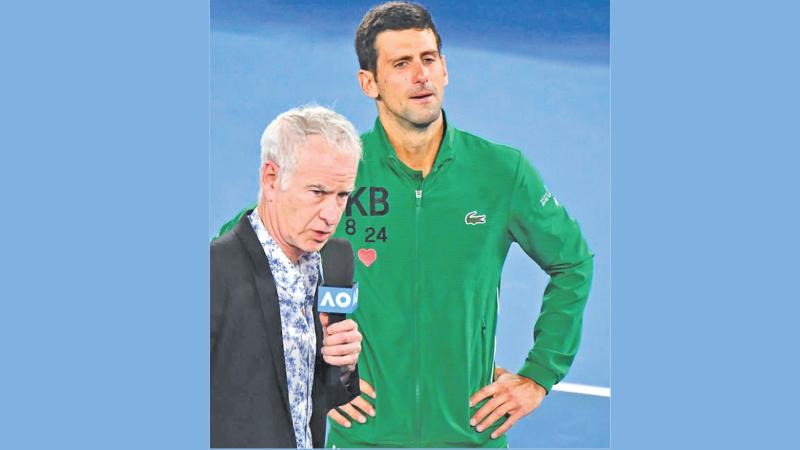 John McEnroe and Novak Djokovic