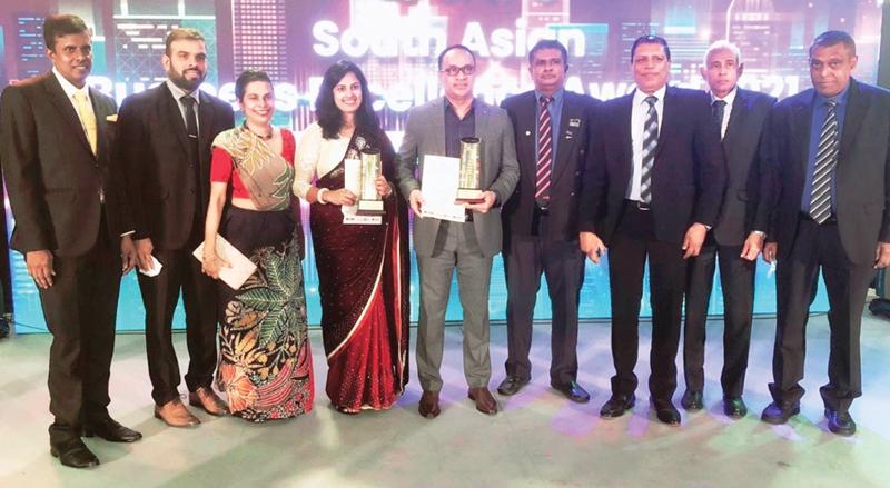 CIPM officials with the awards at the ceremony