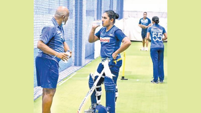 File photo of Hashan Tillekaratne talking to Chamari Atapattu during a training session