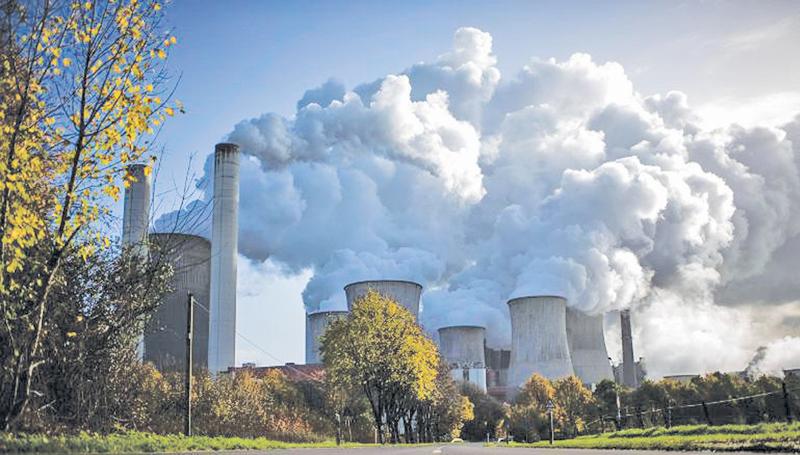 Steam rises from a coal-fired power plant in Germany.