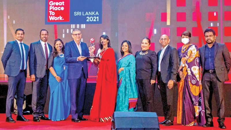 The AIA team with one of the awards