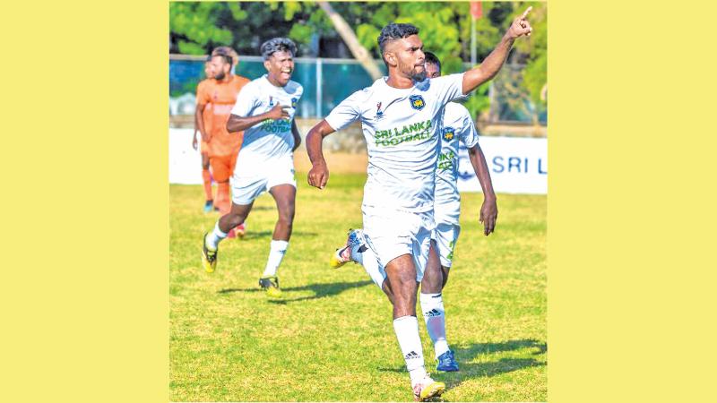 Northern Province player M Nishanthan celebrates scoring a hat-trick of goals