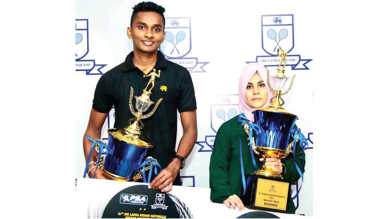 Ravindu Laksiri (left) and Fathoum Issadeen pose with their trophies