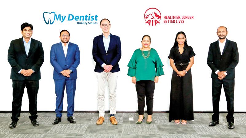 AIA and My Dentist officials after signing the agreement.