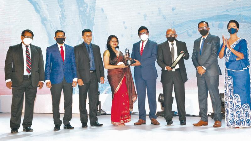 At the awards ceremony: From left - Director, BMIC, Sarath Chandra Fernando, Deputy Managing Director, BMIC, Charith Fernando, Acting Head of Finance, BMIC, Saman Manatunga, Assistant Manager Compliance and Corporate Relationship, BMIC, Dilhara Jayasinghe, Past President, CA Sri Lanka, Ranel T. Wijesinha, Chairman, BMIC, Jagath Godakanda, Chairman, Annual Report Awards Committee, Chaaminda Kumarasiri and Alternate Chairperson, Annual Report Awards Committee, Chamila Cooray.
