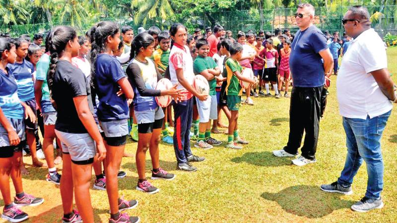 Budding Sri Lanka players come together at a coaching camp conducted by Sri Lanka Rugby (SLR) whose president Rizly Illyas (left) and Sanjeewa Jayawardena (right) the president of the Ruhunu RFU had a first hand insight into the interest shown by over 300 boys and girls in Galle