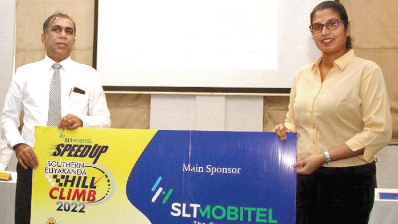 Deputy General Manager SLT-Mobitel, Anne Fernando (right) presenting the main sponsorship for the SLT-Mobitel Speedup Eliyakanda Hill Climb to SLAS president and past president of SMSC Ashhar Hameem at the press briefing in Colombo. Pic by Ruwan de Silva