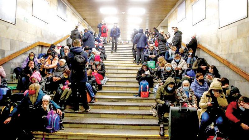 People take shelter in a subway station in Kyiv